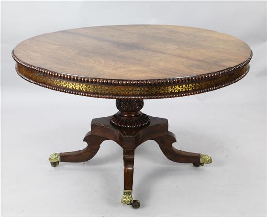 An early 19th century rosewood and brass inlaid breakfast table, Diam. 4ft